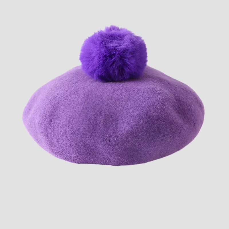 Purple beret with pompom.