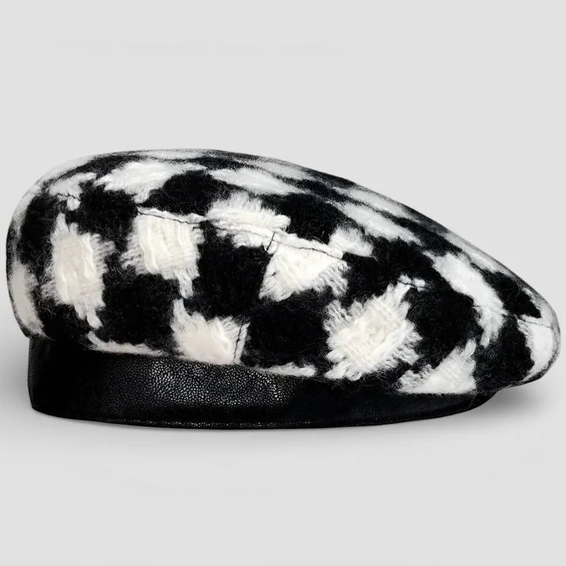 Black and white houndstooth beret with fuzzy top and leather brim