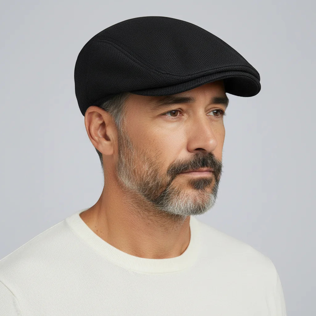 Black beret cap with textured fabric and curved brim