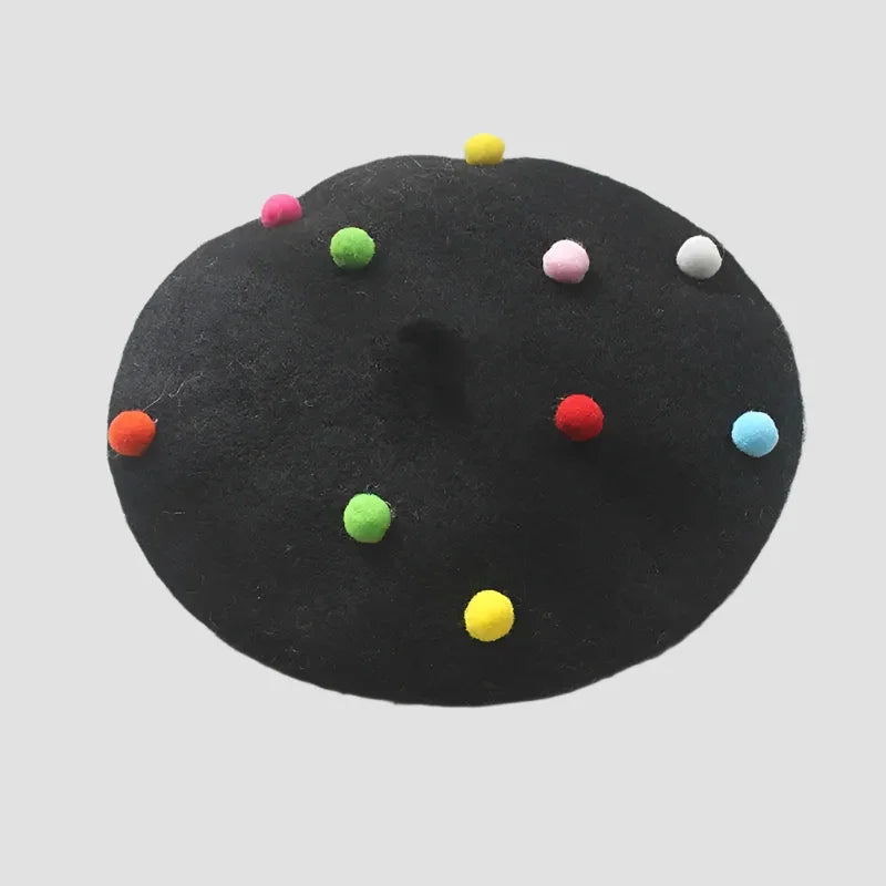 Black beret with colorful pom-poms.