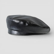 Black faux leather beret with smooth glossy finish and subtle stitching