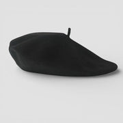 Sleek black French beret with matte finish and top button