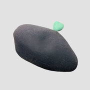 Black beret with green accent.