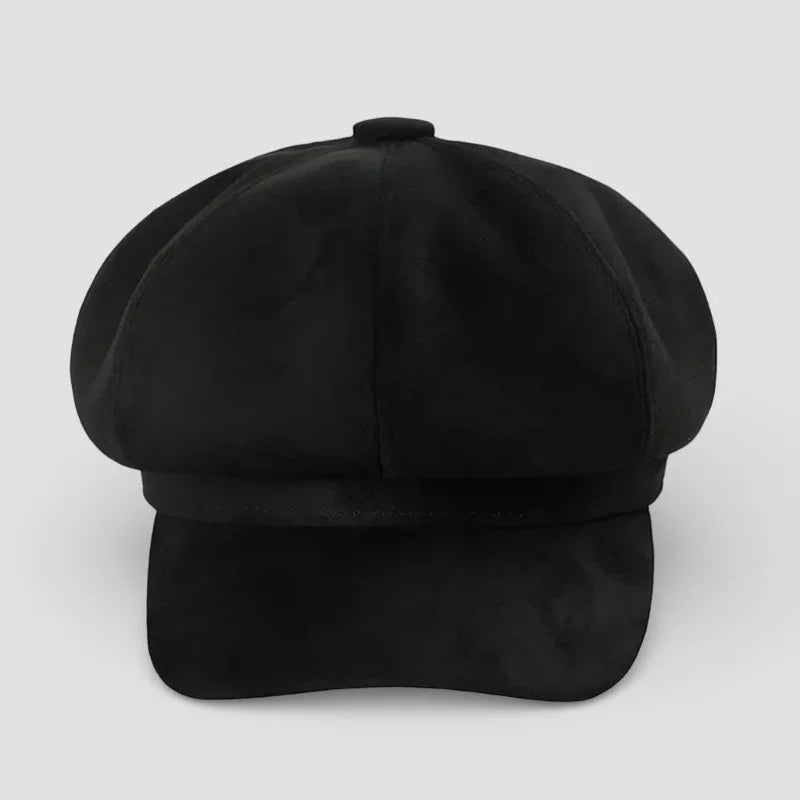 Black suede newsboy cap with structured flat brim and top button