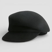 Black wool newsboy cap with flat brim and structured crown