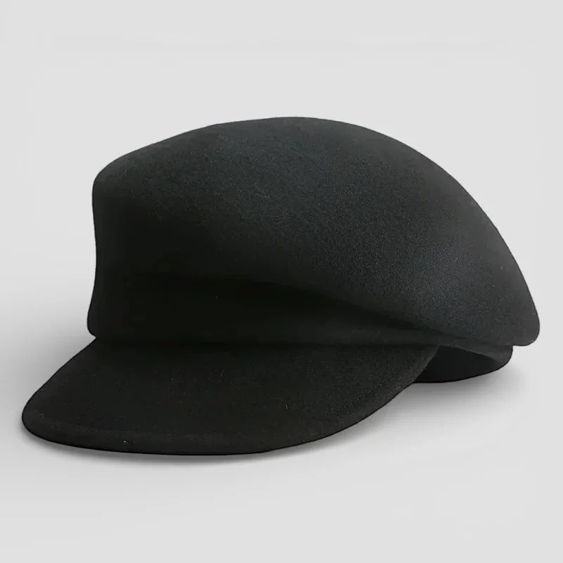 Black wool newsboy cap with flat brim and structured crown
