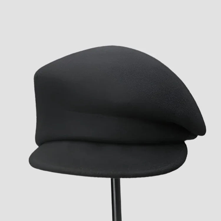 Black newsboy cap.
