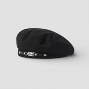 Buckle Beret: black beret with sleek crown and silver buckle strap