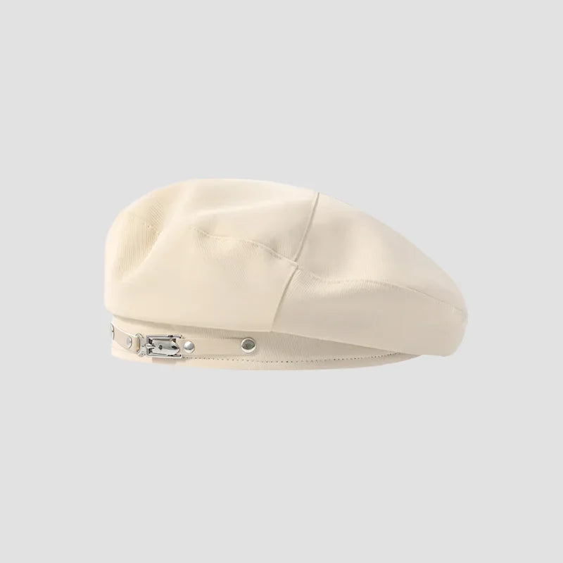 Cream-colored beret with decorative strap.