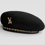 Bunny Beret: black felt beret with gold bunny pin and chain trim