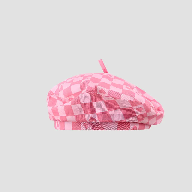 Pink checkered beret with hearts.