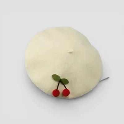 Cherry Beret: cream-colored beret with red felt cherries and green leaves