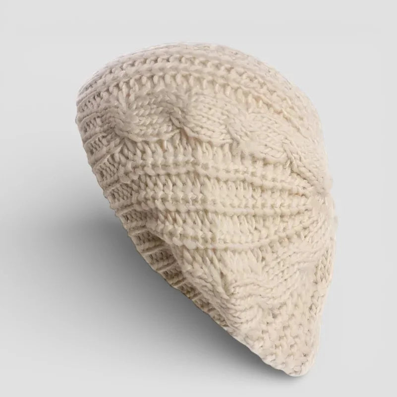 Cream-colored cable-knit beret from Classic French Beret Crochet Pattern