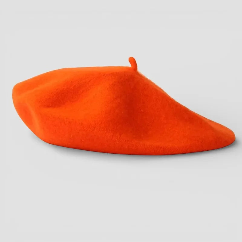 Classic French Beret in vibrant orange with soft felt texture and top tab