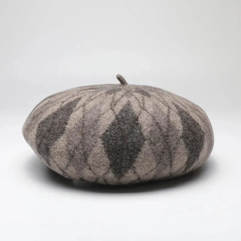 Classic wool beret with soft rounded shape and subtle gray beige argyle pattern