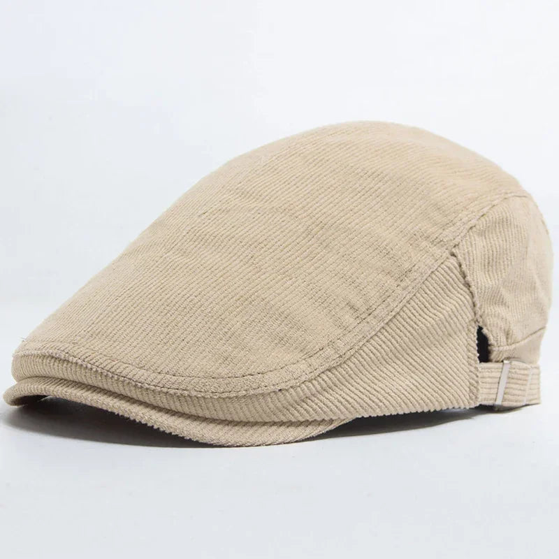 Beige corduroy flat cap.