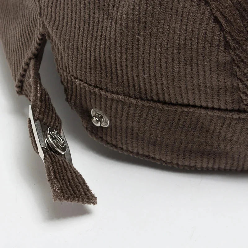 Brown corduroy cap detail.