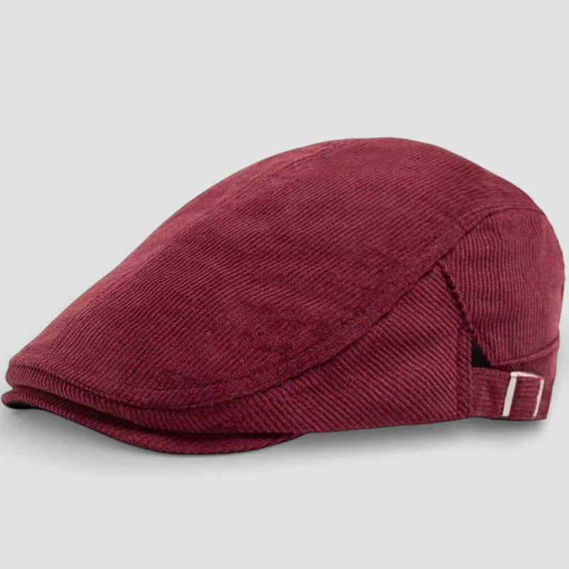 Maroon corduroy beret cap with angled brim and white side buckle