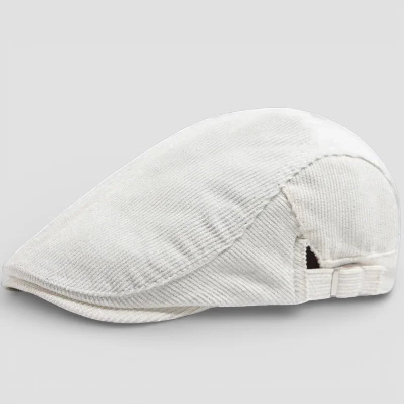 White corduroy flat cap with curved brim and adjustable back strap