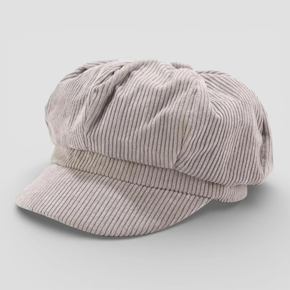Soft beige corduroy newsboy cap with ribbed texture and curved brim