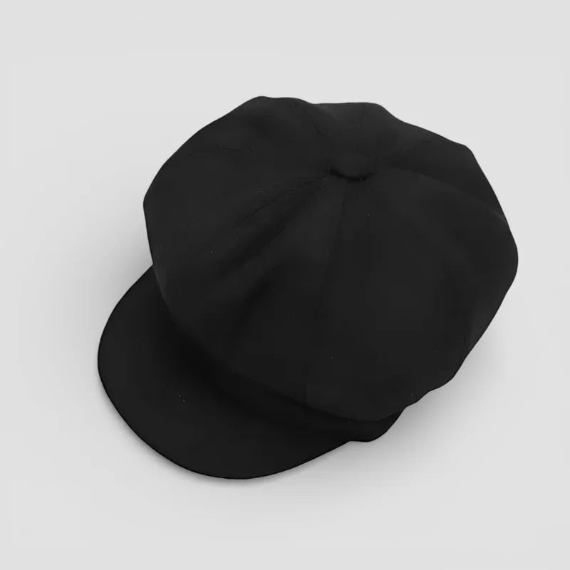 Black 8-panel cotton newsboy hat with flat brim and structured crown