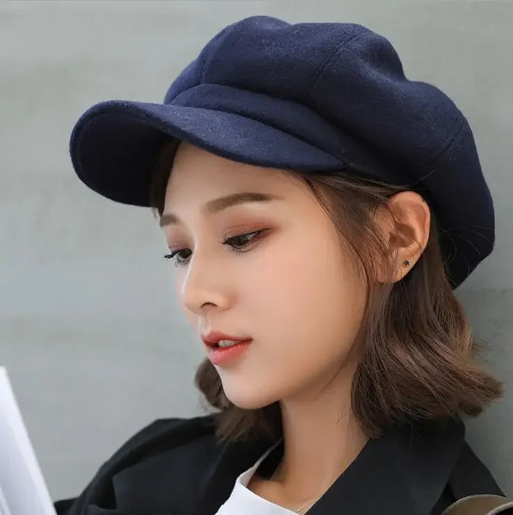Navy blue newsboy cap.