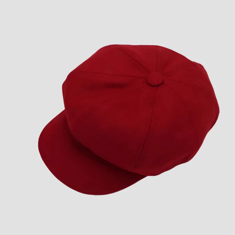 Red newsboy cap.