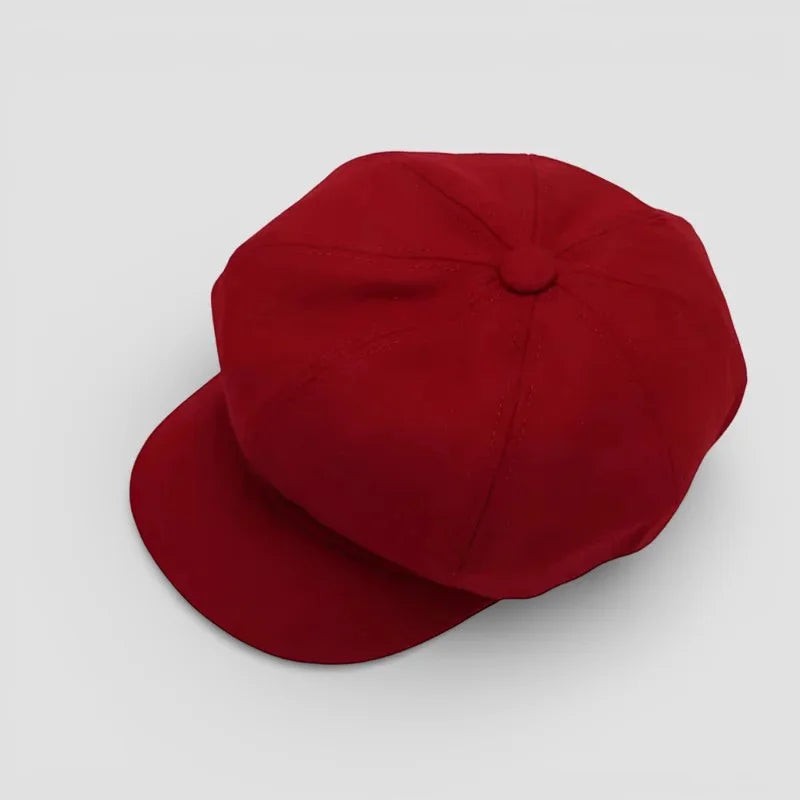 Vibrant red Cotton Newsboy Hat with flat brim and crown button