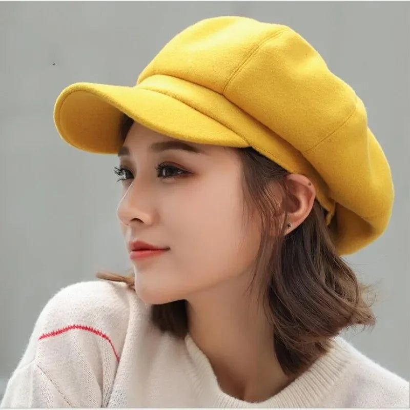 Yellow newsboy cap.