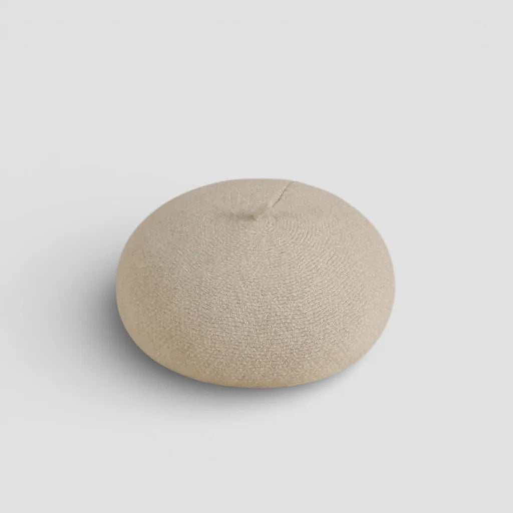 Beige round textured silicone breast form in Cream Wool Beret