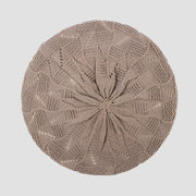 Beige knitted beret.