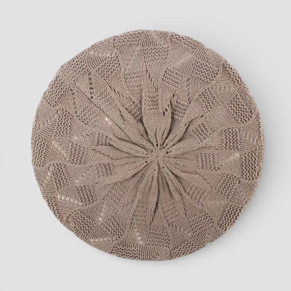 Beige crochet beret with intricate lace pattern radiating from center