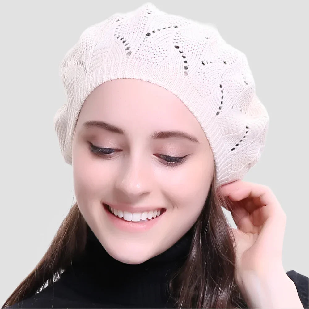 Cream-colored knitted beret.