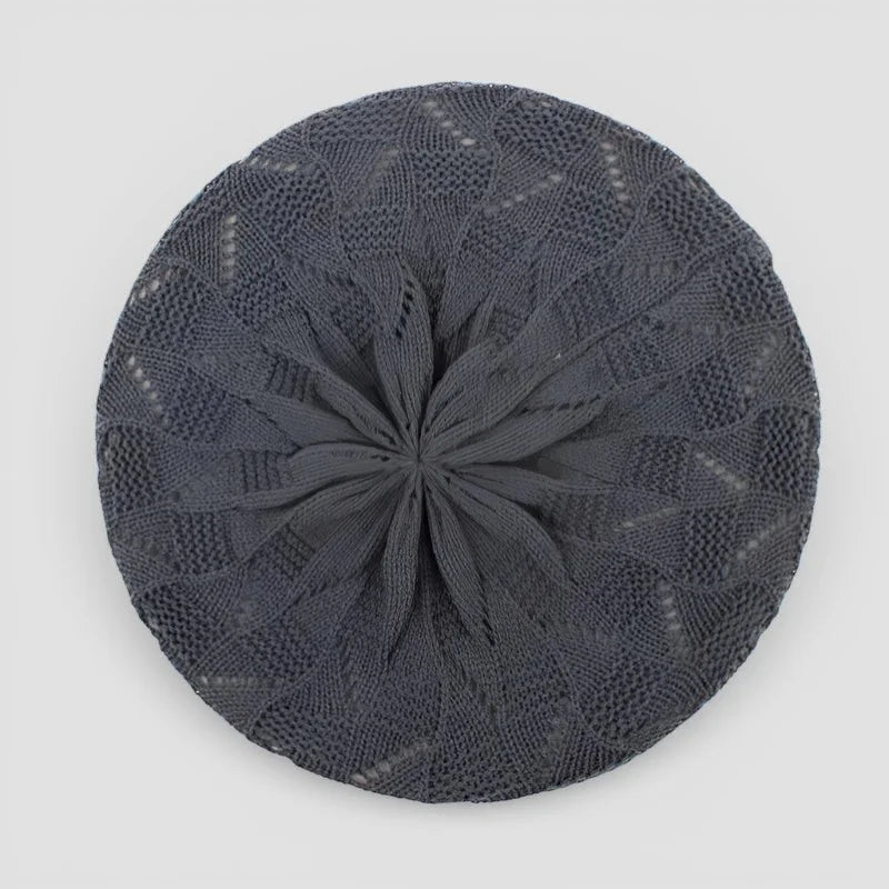 Dark gray knitted beret with intricate lace pattern in Crochet Beret Pattern