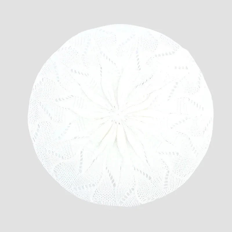White knitted beret.