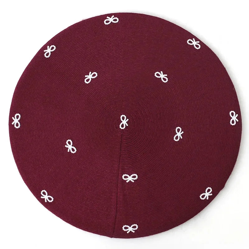 Maroon knitted kippah with white embroidered bows on Crochet Beret with Bow