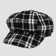 Black and white plaid newsboy cap.