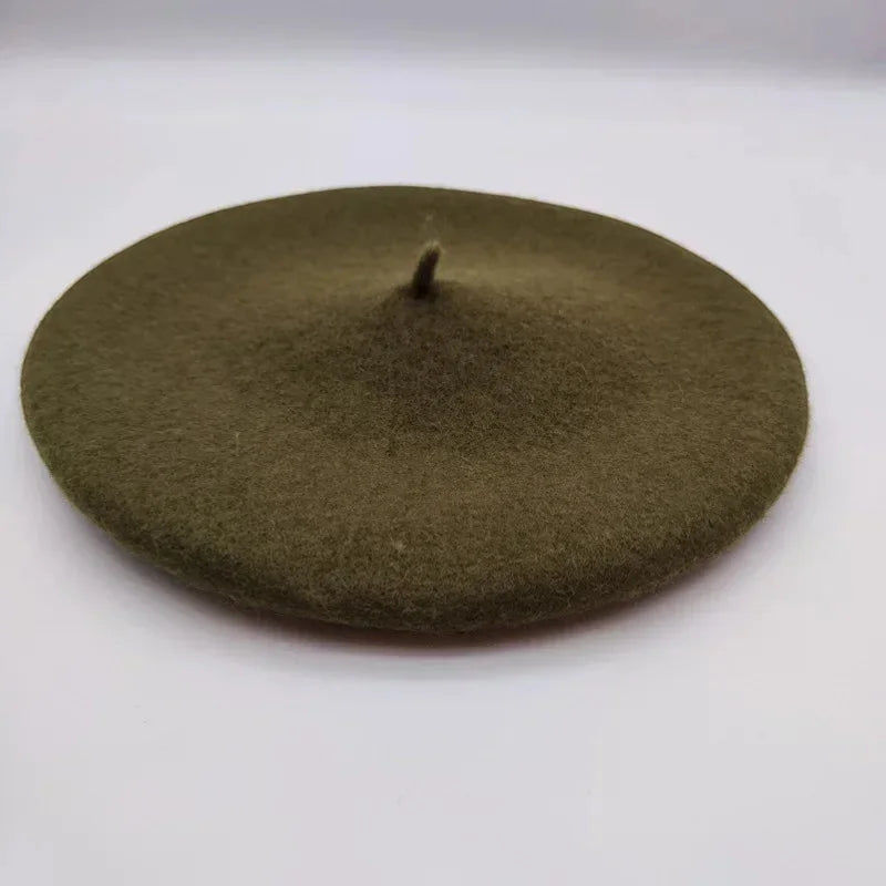 Dark green felt beret with olive green textured surface and central button