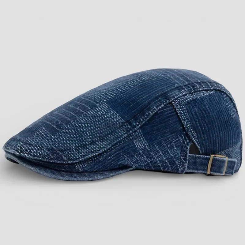 Blue corduroy flat cap with subtle plaid pattern and adjustable strap