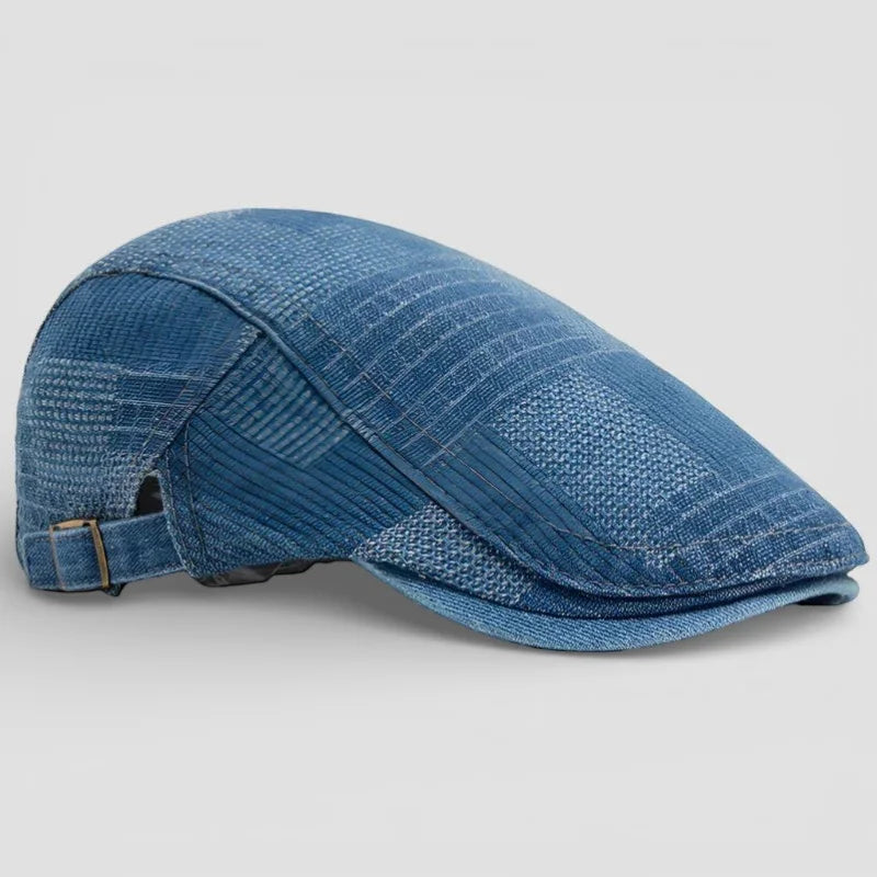 Blue denim flat cap with woven texture and stitching on Denim Beret Cap