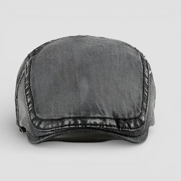 Dark gray denim beret hat with structured worn texture and stitched seams