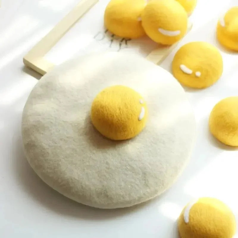 Egg Beret plush yellow felt emoji on fluffy off-white base