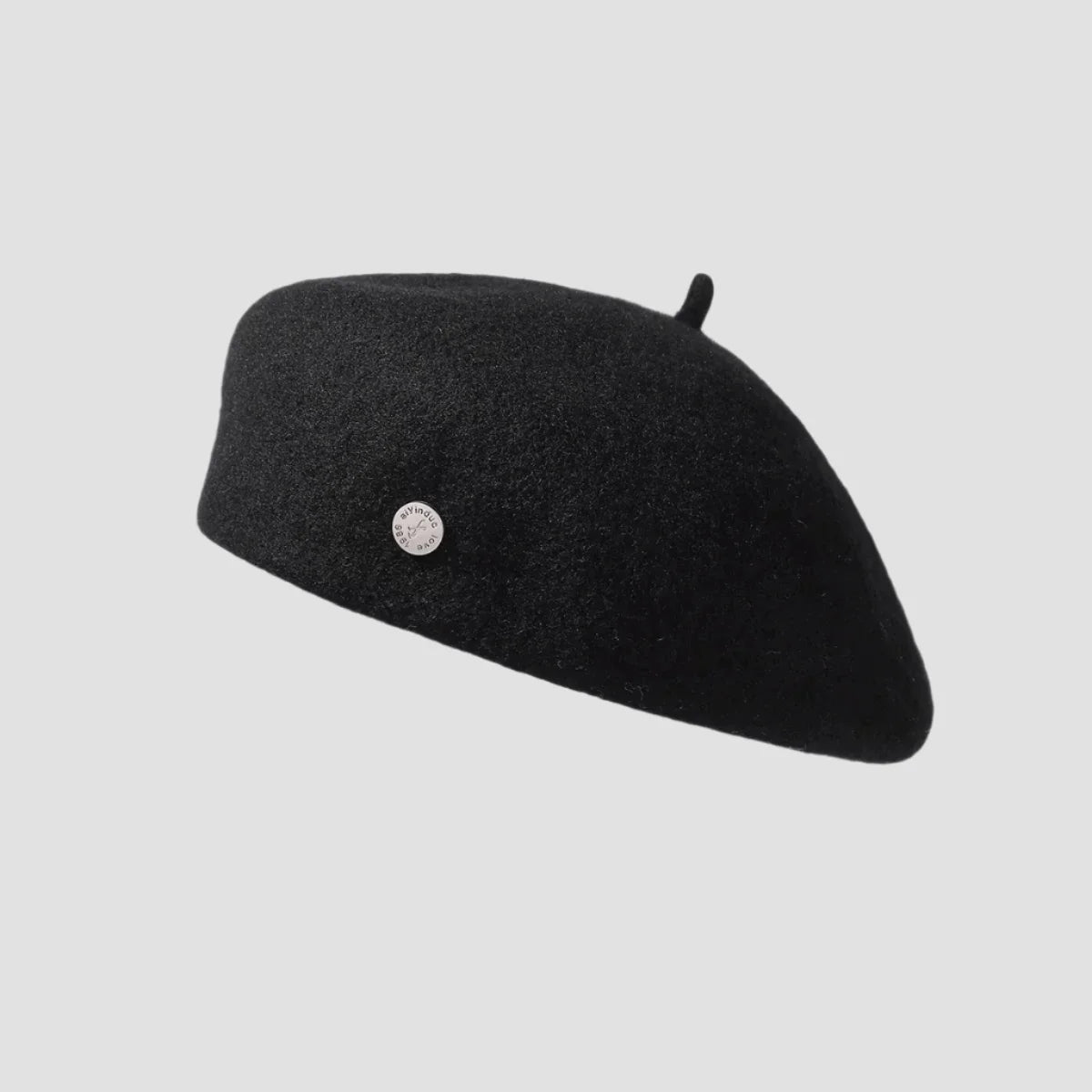 Black wool beret with button.
