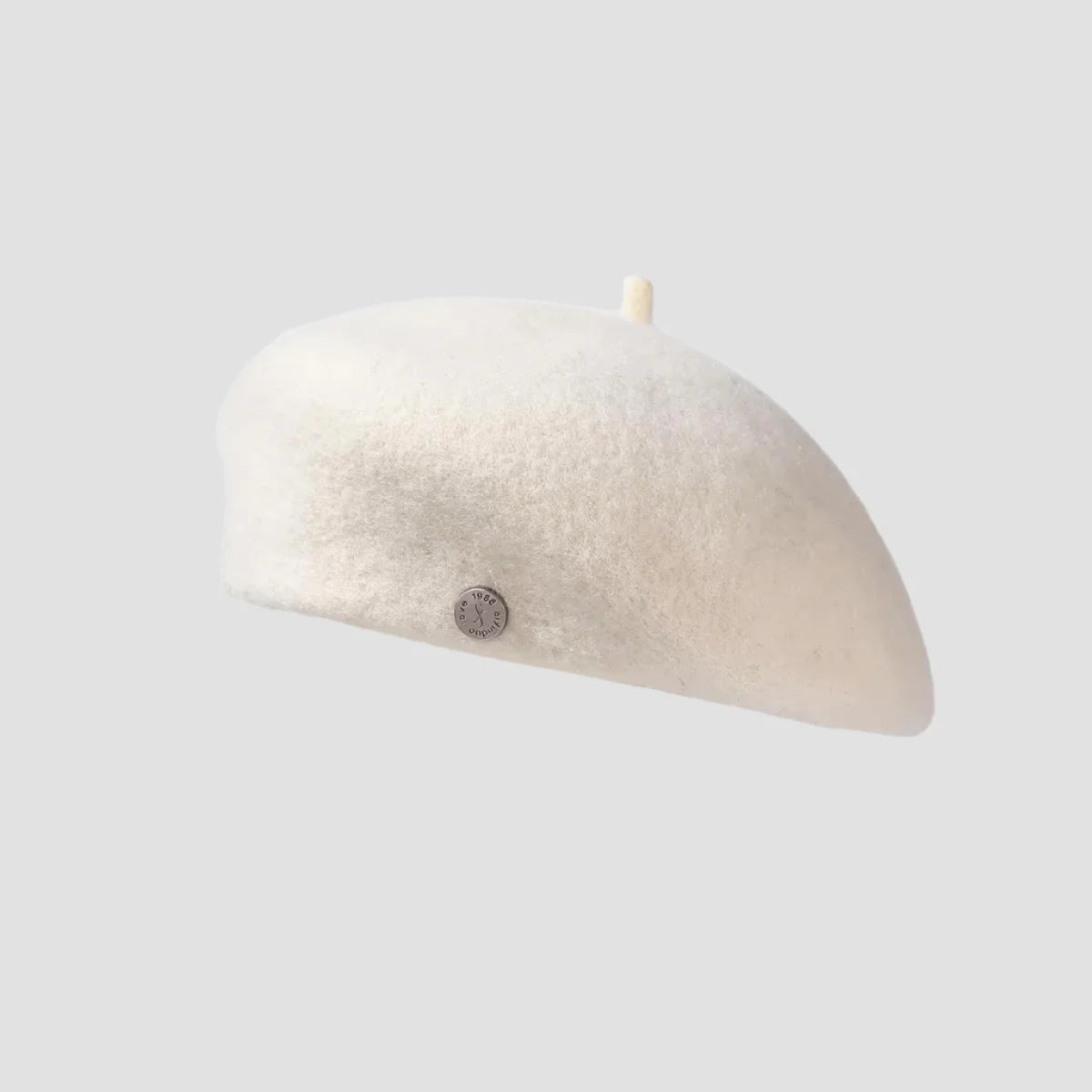 Cream-colored, fuzzy beret.