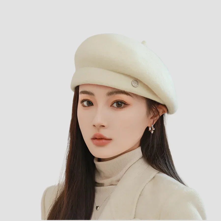 Woman wearing a cream-colored beret.