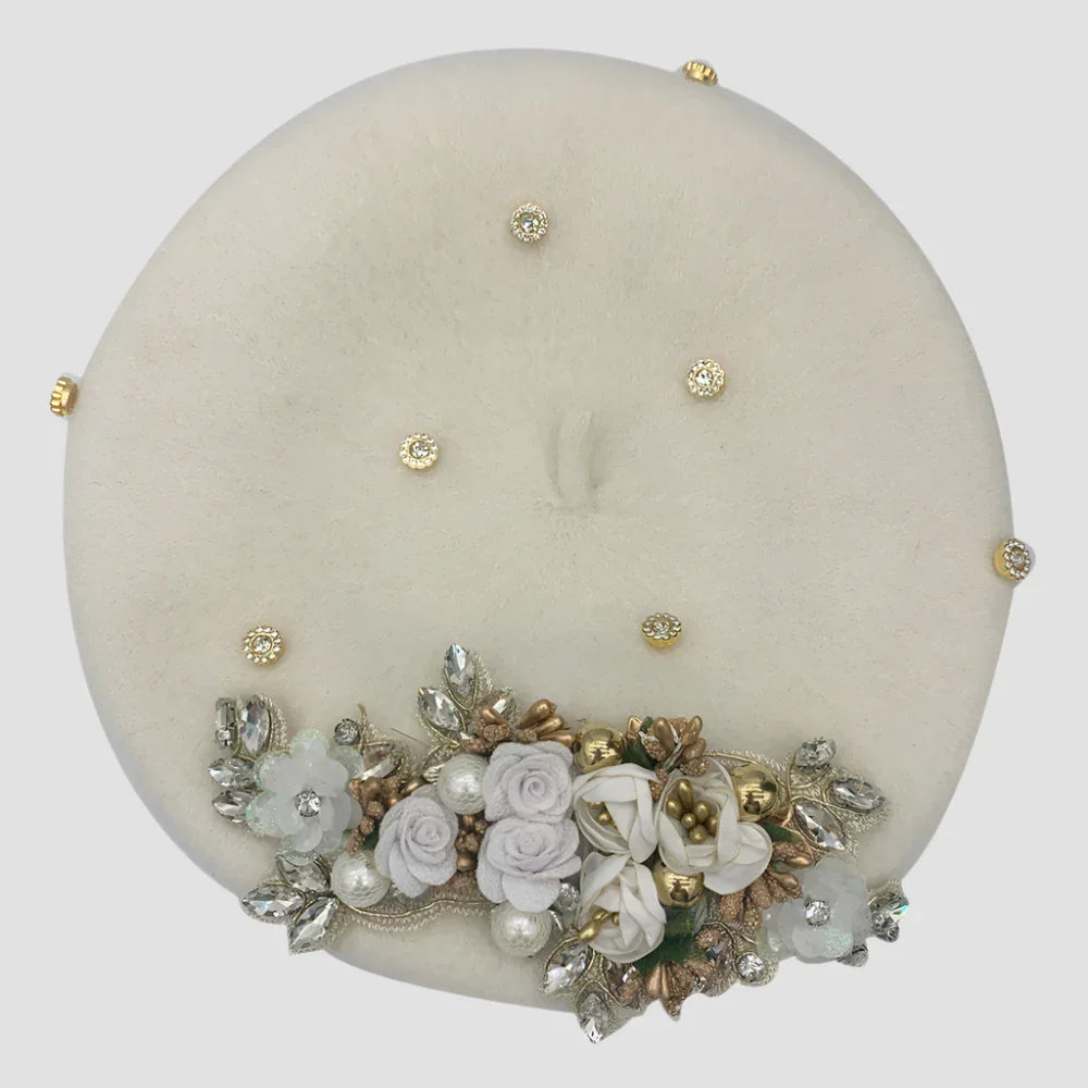 Embellished white beret.