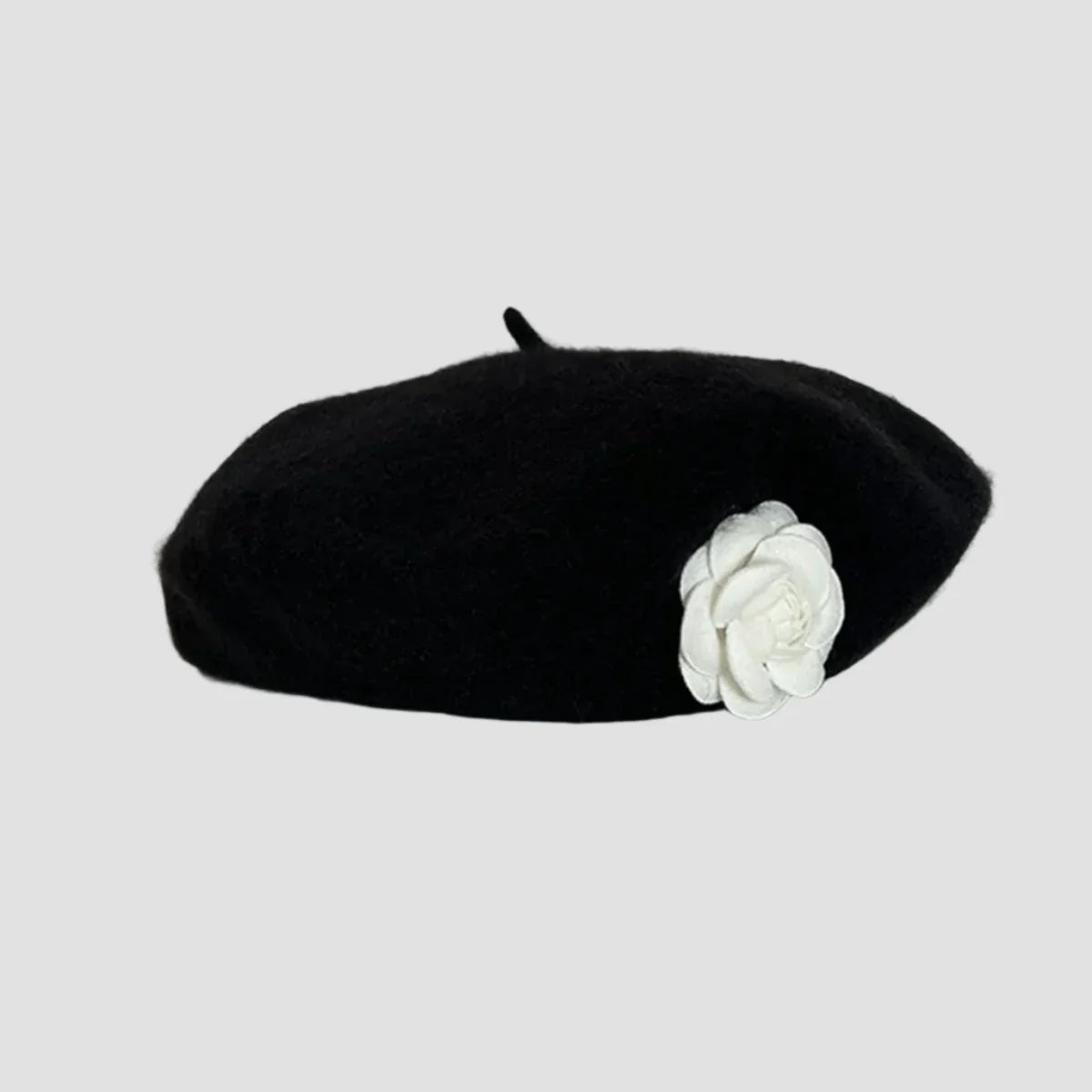 Black beret with white flower.