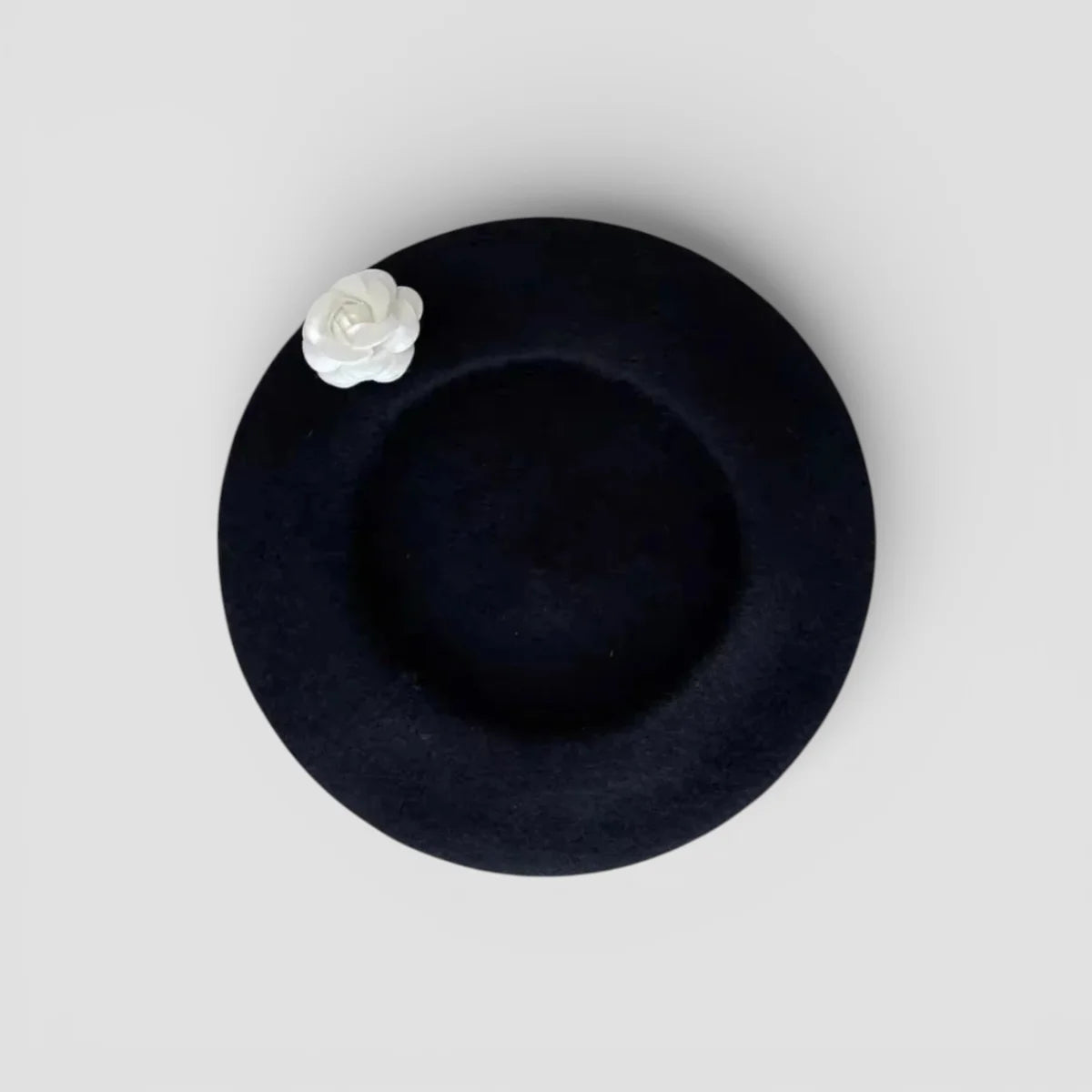 Sleek black Flower Beret with delicate white fabric rose on side