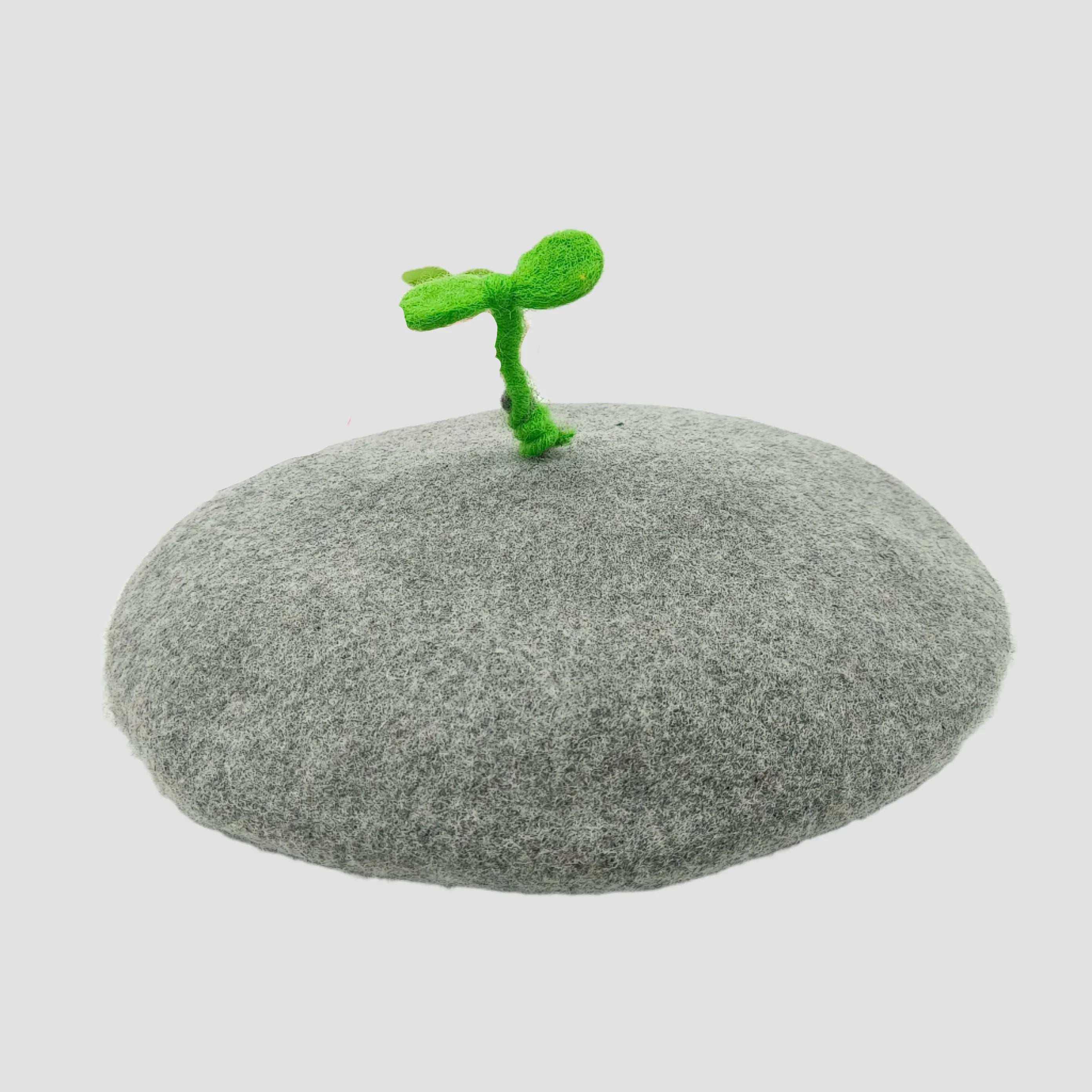 Gray beret with green sprout.