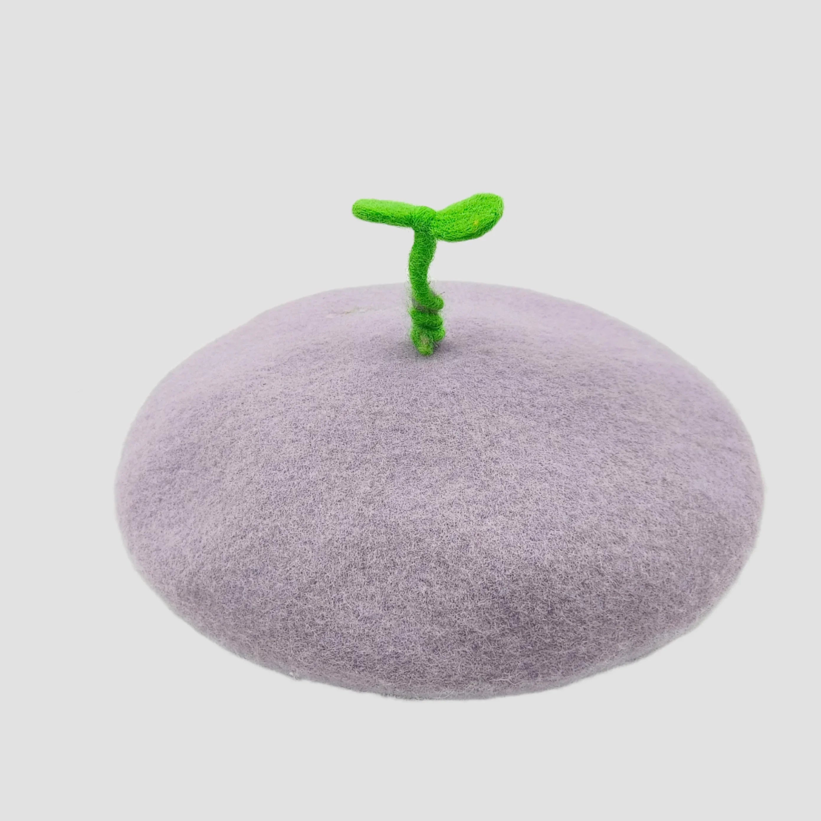 Lilac beret with green sprout.